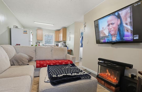 open floorplan, kitchen, living room, carpet