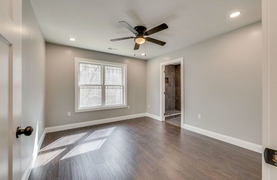 primary bedroom, laminate flooring, ceiling fan, window, ensuite bathroom, recessed lighting