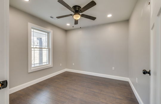 bonus room, window, ceiling fan, laminate flooring, recessed lighting