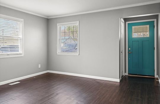 living room, front door, closet, luxury vinyl flooring, windows