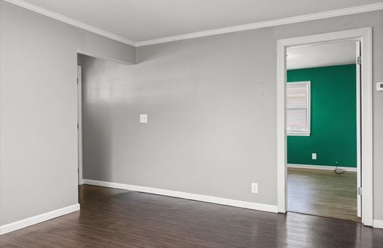 living room, luxury vinyl flooring, doorways to bedrooms