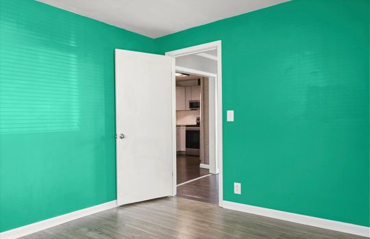 third bedroom, door, luxury vinyl flooring