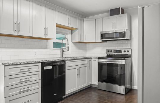 kitchen, tile backsplash, sink, dishwasher, refrigerator, range, cabinets, countertops, windowf