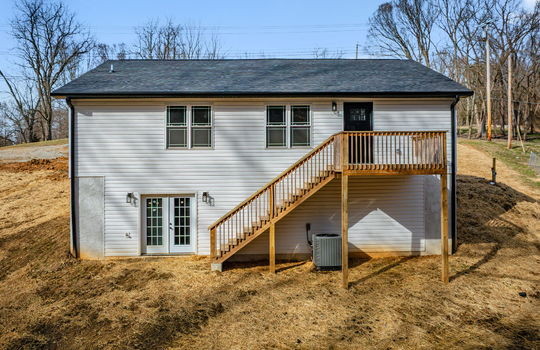 back of home, exterior doors, siding, windows, back deck, stairs to back deck, back yard