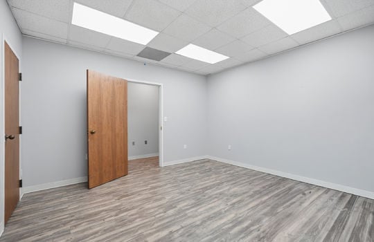 secondary office, private office, private bathroom, luxury vinyl flooring, fluorescent lighting