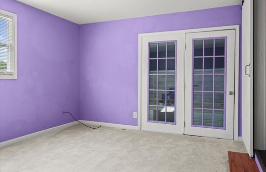 primary bedroom, door to storage room, carpet, window