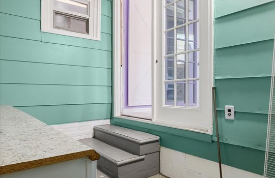 utility room, steps, cabinets, countertops, window