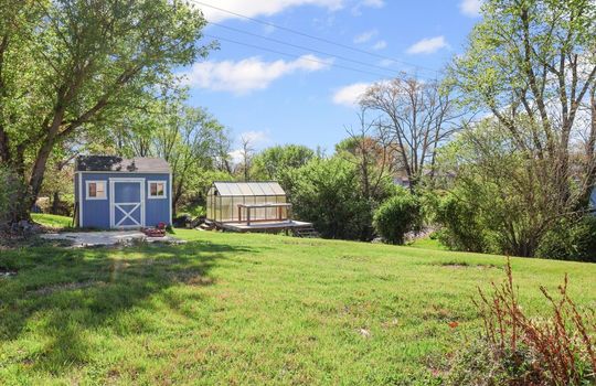 back yard, storage shed, greenhouse, yard, trees