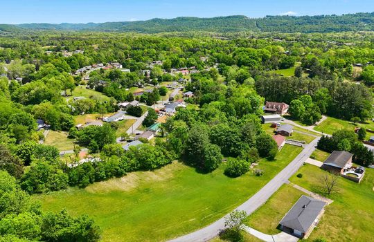 1.41 +/- acres, 3 parcels, For Sale, 341 ft road frontage, neighboring homes, aerial photo, mountains