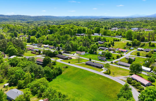 1.41 +/- acres, 3 parcels, For Sale, 341 ft road frontage, neighboring homes, aerial photo, mountains