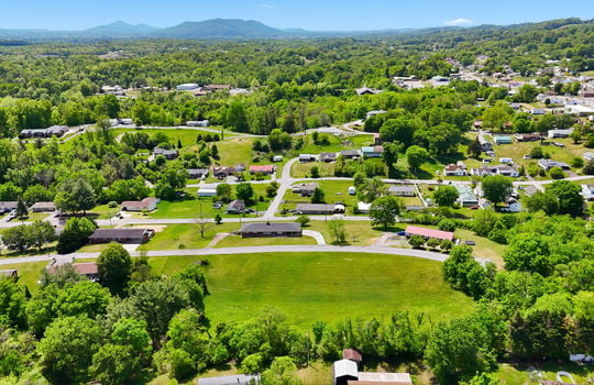 1.41 +/- acres, 3 parcels, For Sale, 341 ft road frontage, neighboring homes, aerial photo, mountains