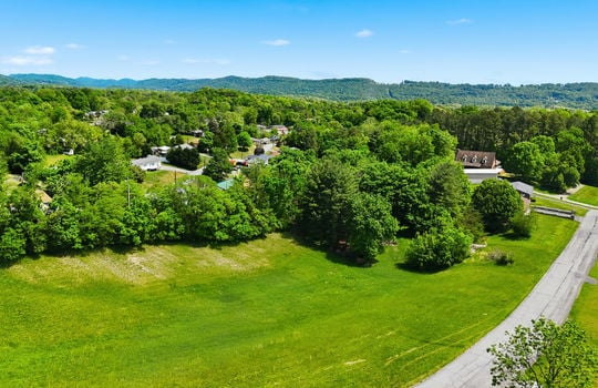 1.41 +/- acres, 3 parcels, For Sale, 341 ft road frontage, neighboring homes, aerial photo, mountains