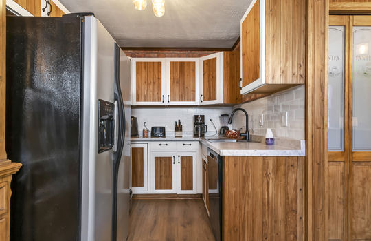 kitchen, refrigerator, dishwasher, range, cabinets, countertops, luxury vinyl flooring