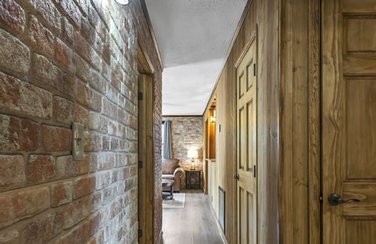 hallway, brick wall, paneling walls, doors