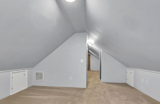 bonus room view into bedroom area, dormer ceilings, carpet, stairs