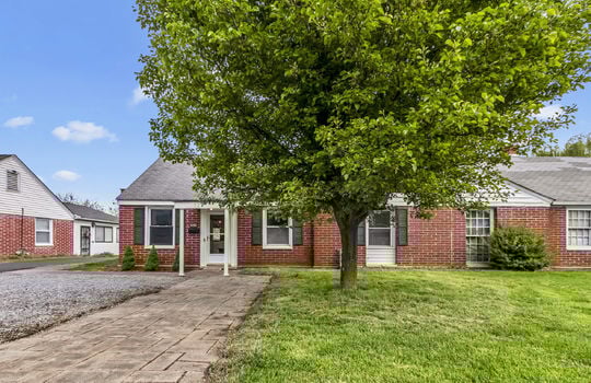 duplex, brick exterior, front door, sidewalk, landscaping