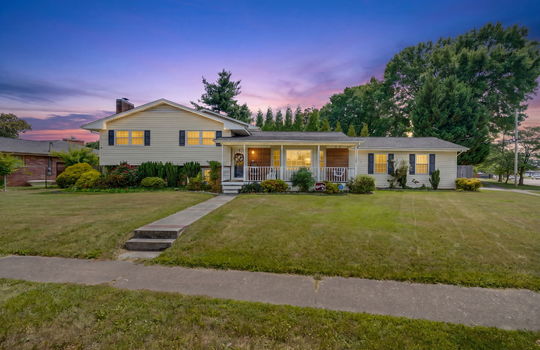 twilight photo, front yard, front porch, covered front porch, vinyl siding, brick, front door, landscaping
