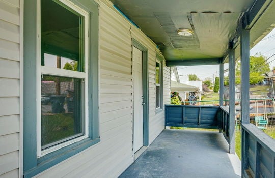 covered front porch, porch, vinyl siding, front door, windows