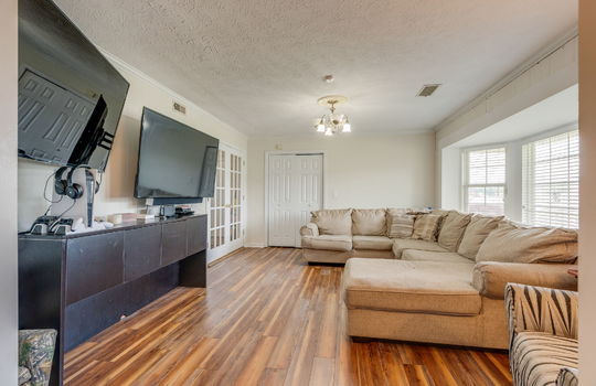living room, bay window, hardwood flooring, french doors