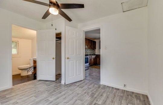 primary bedroom, closet, bathroom, ceiling fan, laminate flooring
