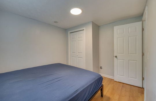 bedroom, laminate flooring, closet, door