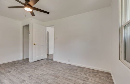 bedroom, closet, laminate flooring, window, ceiling fan