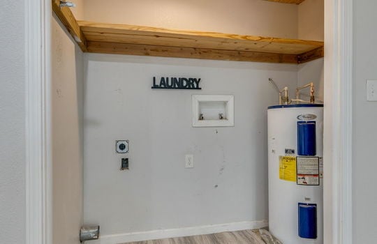laundry room, water heater, washer/dryer hookups, shelving