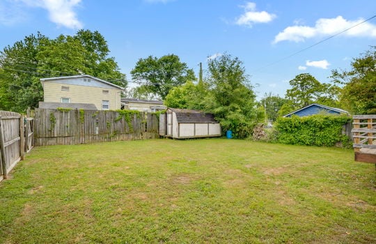 fenced back yard, shed, fencing, yard, neighboring homes