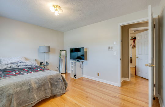 bedroom, hardwood flooring, door