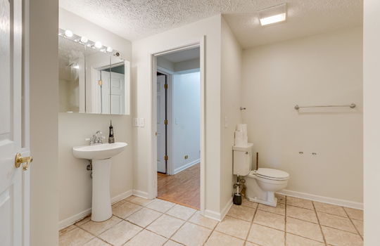bathroom, pedestal sink, toilet, tile flooring
