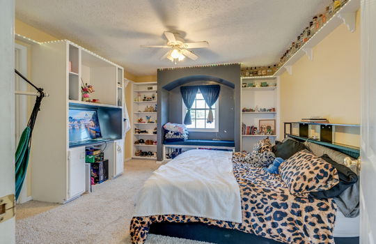 bedroom, built-in shelving, ceiling fan, window nook, carpet