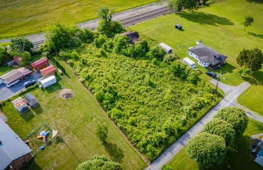 Aerial photo, 0.79 +/- acres, road, trees, barn, neighboring homes