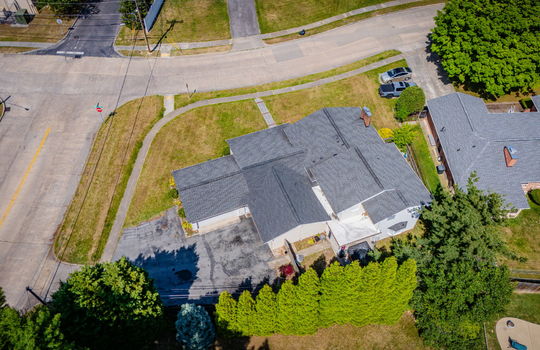 aerial photo, tri-level home, front yard, back yard, driveway, sidewalk, road, neighboring homes
