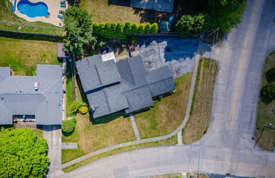 aerial photo, tri-level home, front yard, back yard, driveway, sidewalk, road, neighboring homes