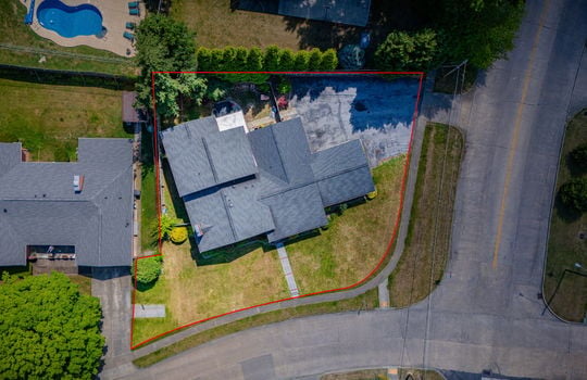 aerial photo, tri-level home, front yard, back yard, driveway, sidewalk, road, neighboring homes, property outline