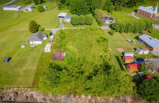Aerial photo, 0.79 +/- acres, road, trees, barn, neighboring homes