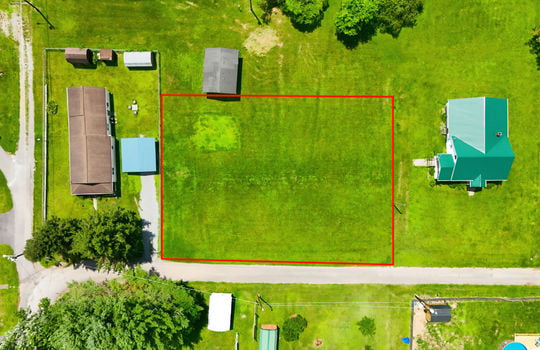 Aerial photo, land, 0.331+/- acres, neighboring homes, road, trees, property outline