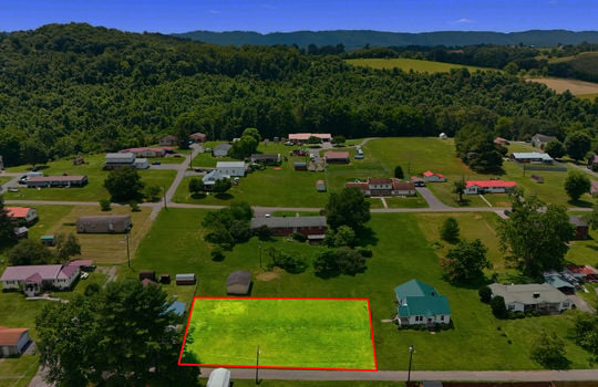 Aerial photo, land, 0.331+/- acres, neighboring homes, road, trees, mountains, property outline