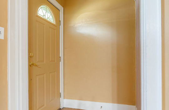 front door, entryway/foyer, hardwood flooring