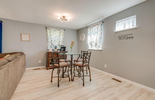 dining space, luxury vinyl flooring, open floorplan, windows