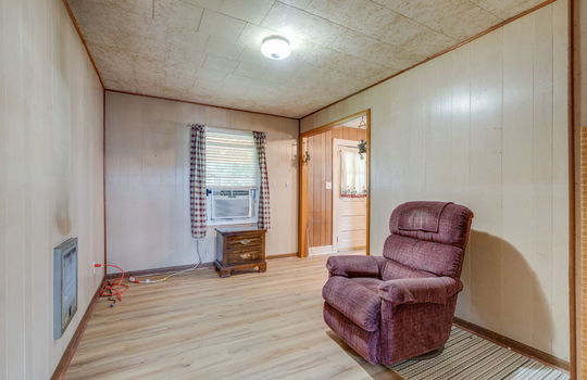 dining room, laminate flooring, window, paneling walls