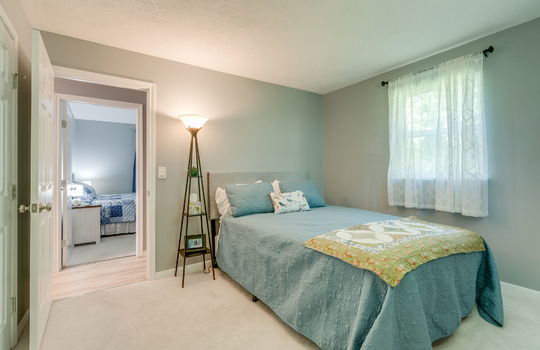 bedroom, carpet, windows, door to hallway, closet