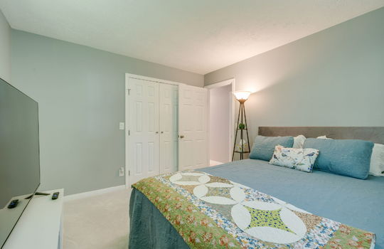 bedroom, carpet, closet, doorway to hallway