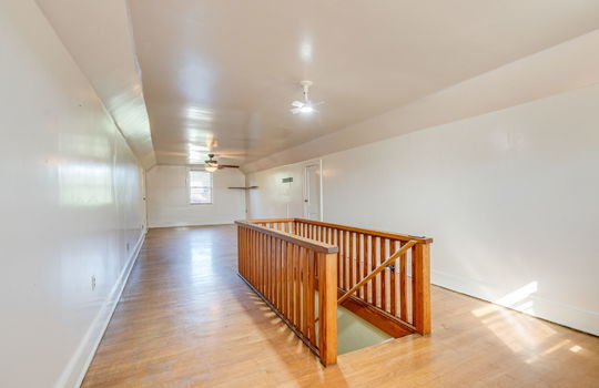 upper level bonus space/loft, hardwood flooring, ceiling fans, stairs, storage, windows