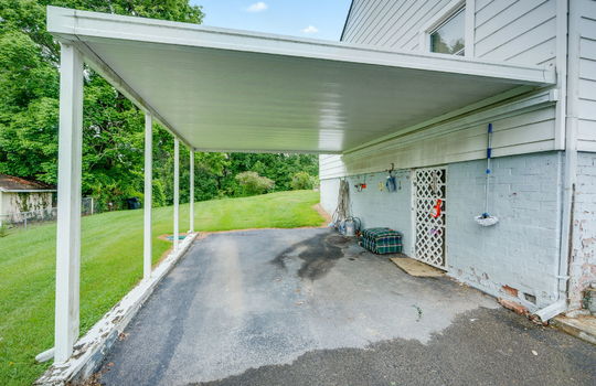 carport, driveway, vinyl siding, back yard, side yard
