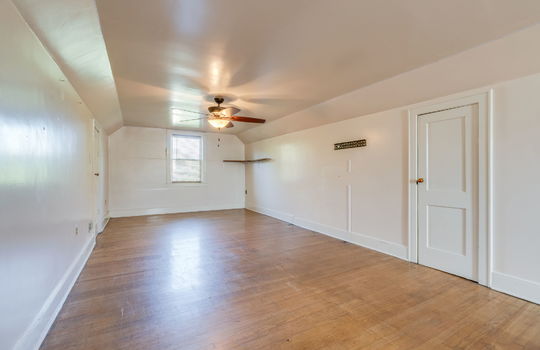 upper level bonus space, hardwood flooring, stairs, windows, ceiling fans, storage