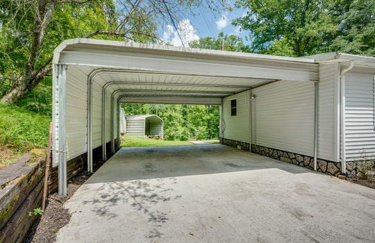attached carport, driveway, metal carport