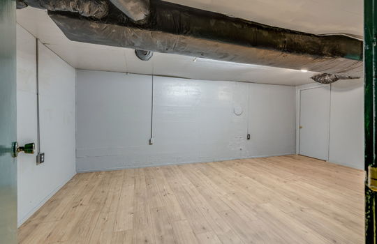 family room, bonus space, vinyl flooring, doorway