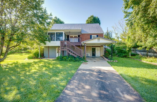back of home, driveway, back porch, carport, sunroom, back yard, trees, landscaping
