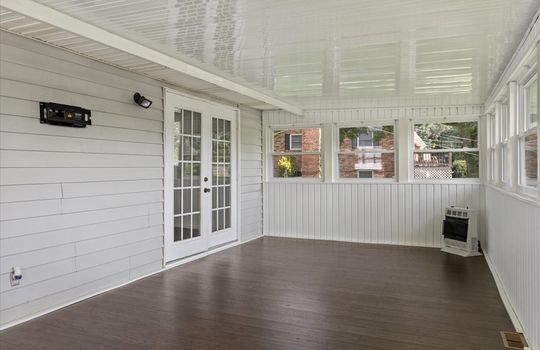 sunroom, windows, double doors to kitchen